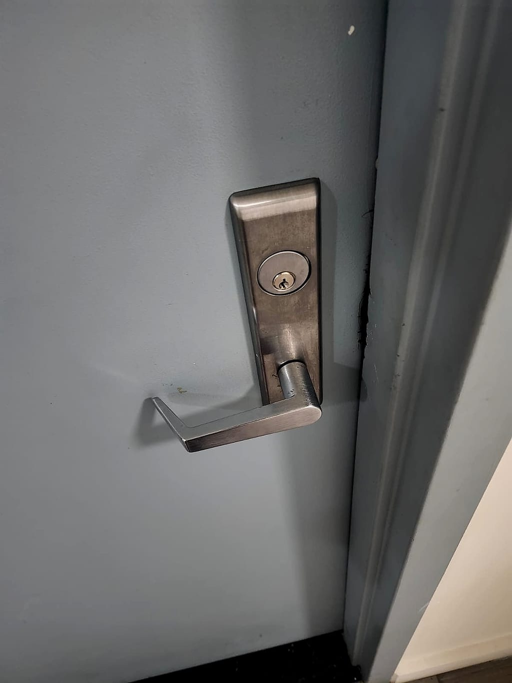 New satin mortise lever lockset installed on the same apartment door