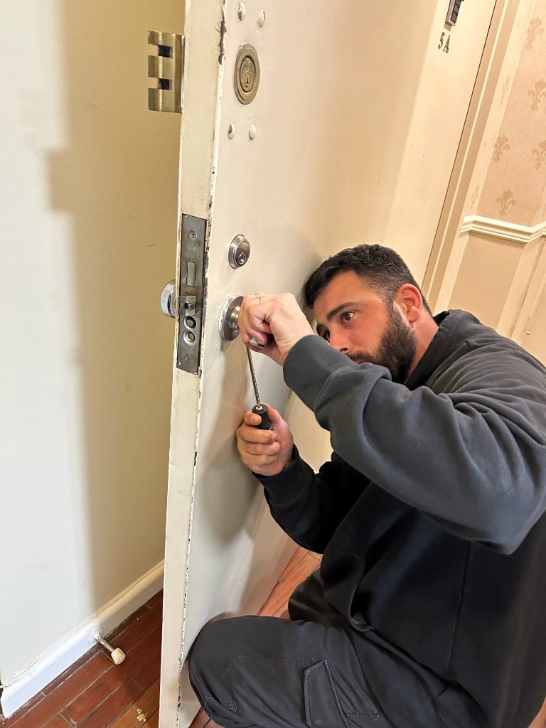 Sunny Locksmith technician working on a commercial door
