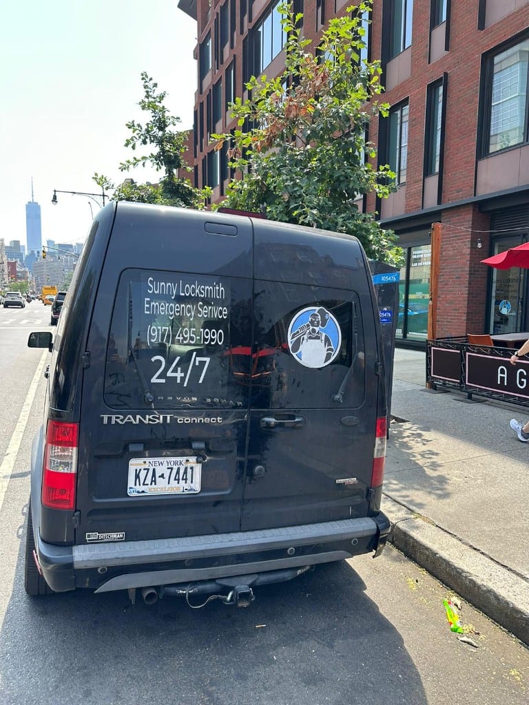 Sunny Locksmith service van — rear with 24/7 emergency contact